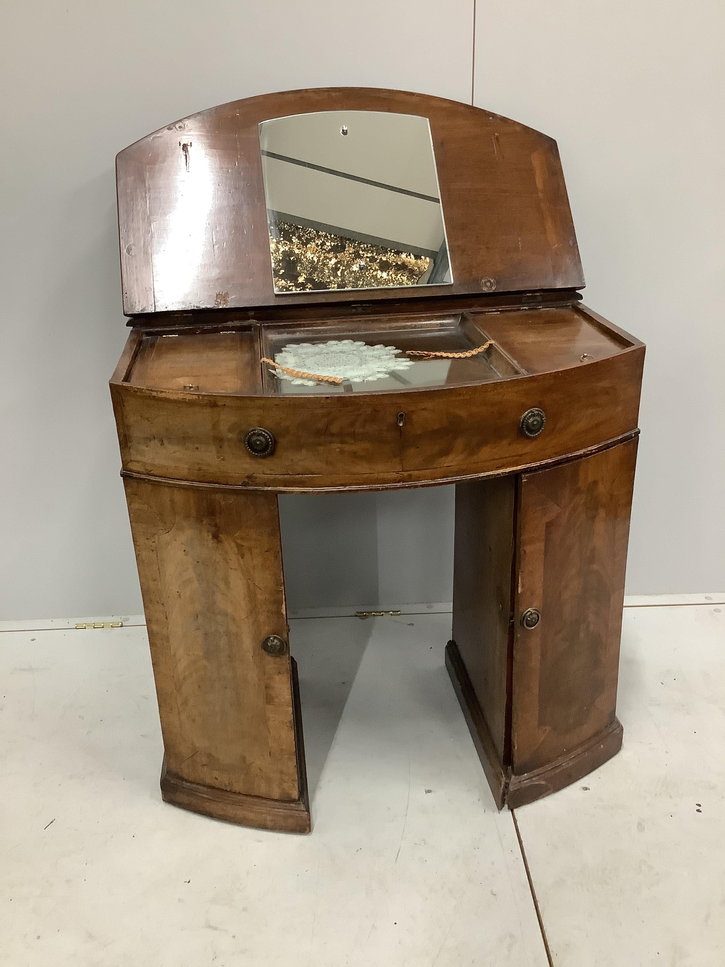 A 19th century and later bowfront enclosed dressing table, with hinged top, width 93cm, depth 49cm, height 80cm